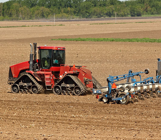 Red Tractor Grading Field